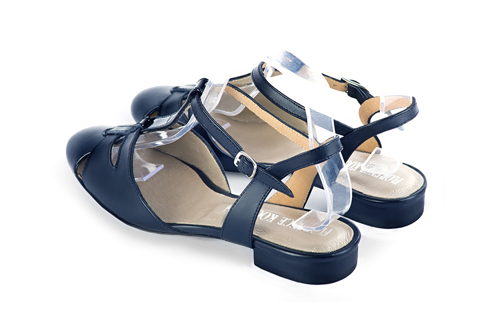 Women's navy blue open back T-strap dress shoes. Round toe. Thin leather soles - Rear view